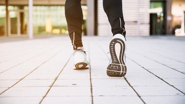 Free photo crop legs running on street