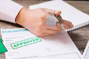 Free photo crop man giving new house key