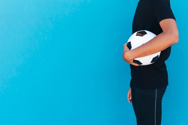 Free Photo crop man standing with football