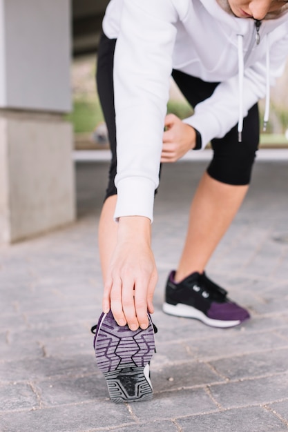 Free photo crop woman exercising on pavement