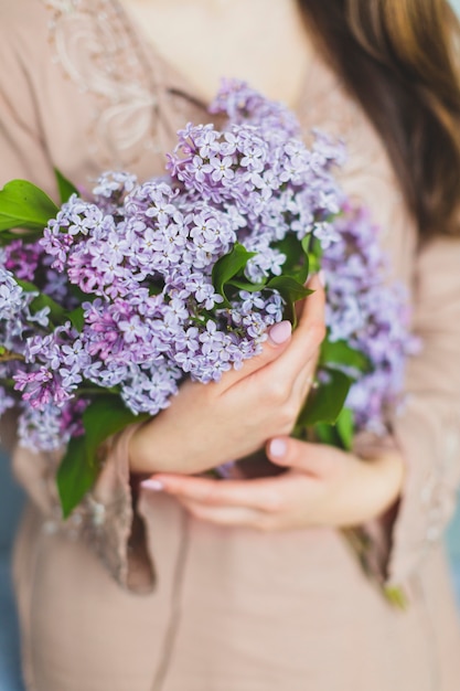 Free Photo crop woman holding lilac