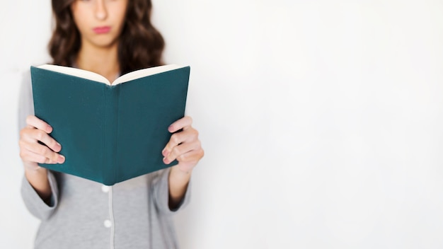 Free photo crop woman reading book