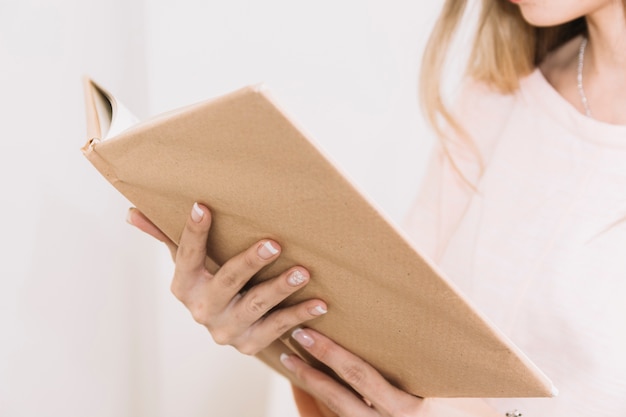 Free Photo crop woman reading book