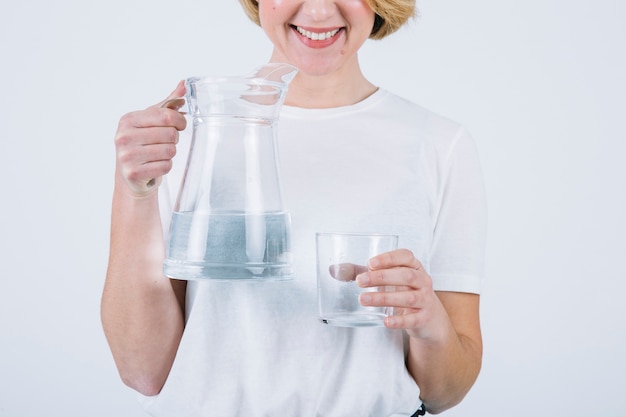 Free photo crop woman with water on white background