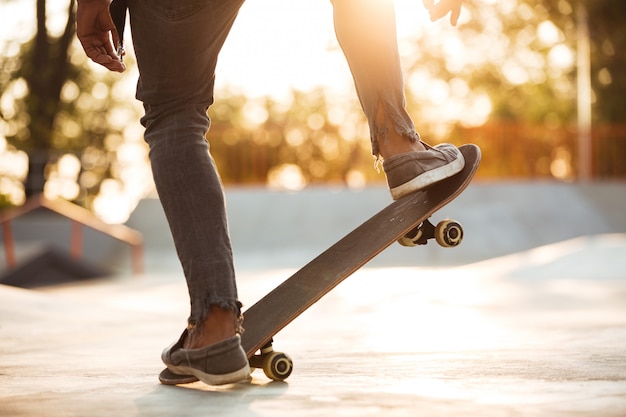 Cropped image of a skater boy practicing