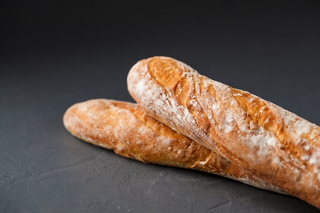 Cropped photo of two french baguettes