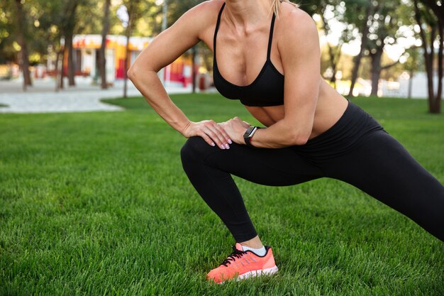 Cropped picture of amazing strong young sports woman