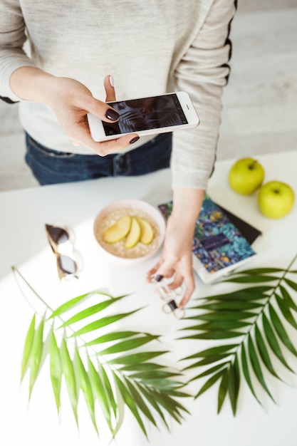 Free photo cropped picture of woman hands holding  little perfume bottle.