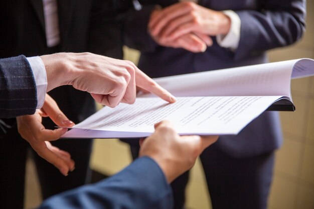 Cropped view of businesswomen reading document