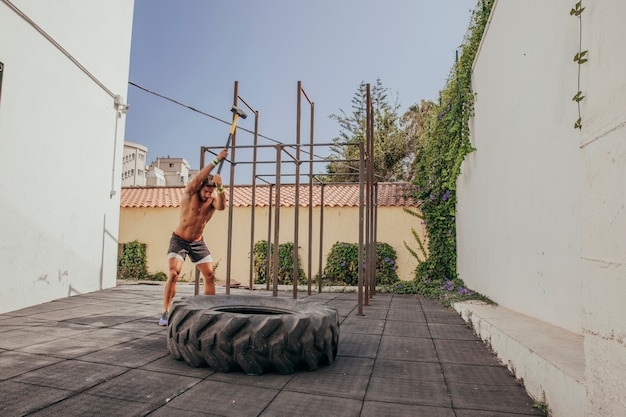 Free photo crossfit concept with tractor wheel