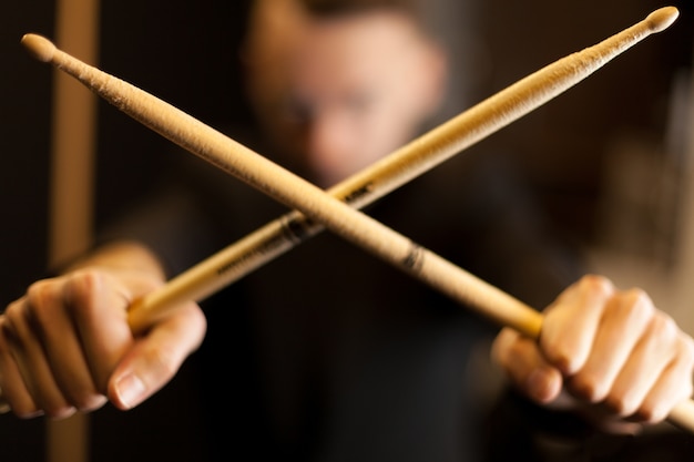 Free photo crossing two drumsticks