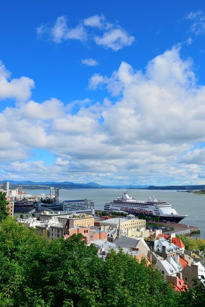 Cruise ship and lower town old buildings with blue sky in Quebec City.