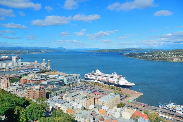 Cruise ship and lower town old buildings with blue sky in Quebec City.