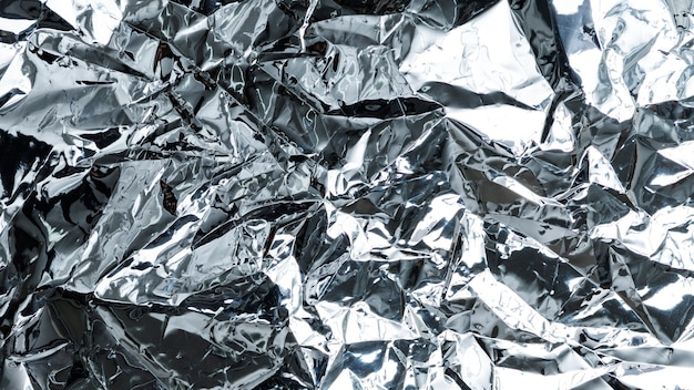 Free photo crumpled aluminum foil textured background