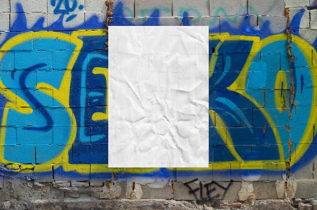 Free photo crumpled poster on colourful graffiti background