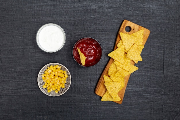 Free Photo crunchy traditional nachos with dips and corn