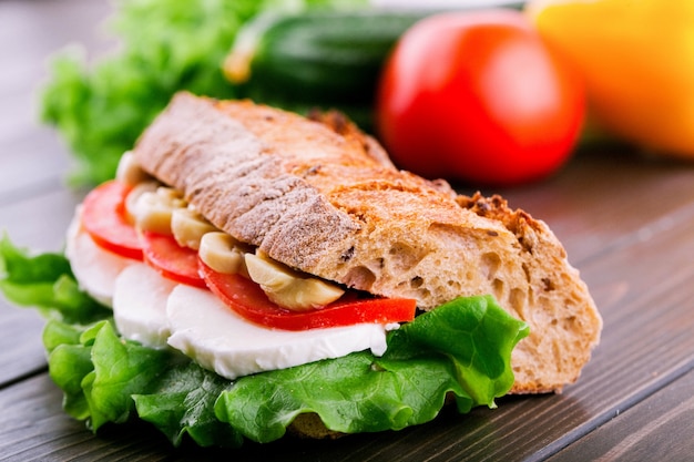 Free Photo crusty wholemeal bread sandwich with mushrooms, tomatoes, eggs and salad