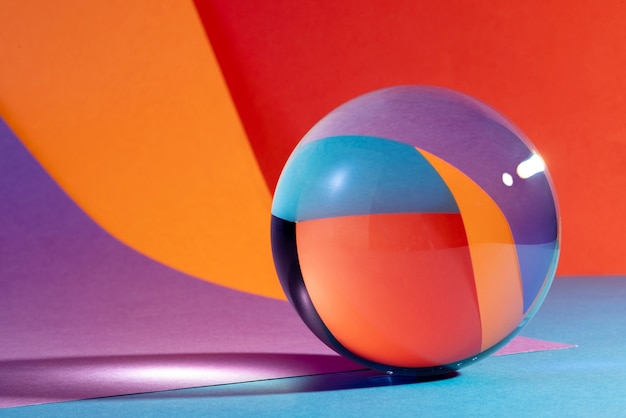 Free photo crystal ball with coloured background