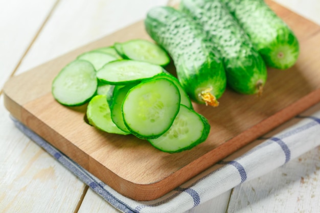 Cucumbers on wooden background