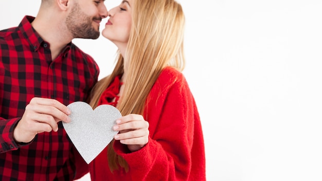 Cuddling couple with heart