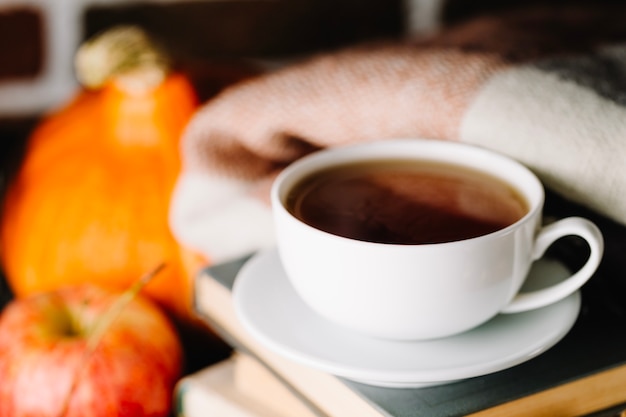 Cup of coffee and books