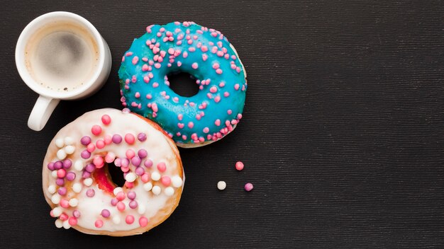 Cup of coffee and doughnuts