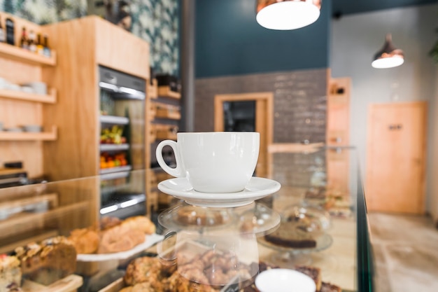 Free photo cup of coffee on glass counter