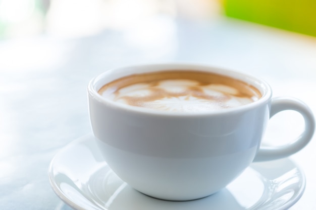 Cup of coffee on a plate