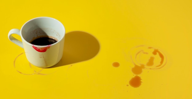 Free photo cup of coffee stained with lipstick