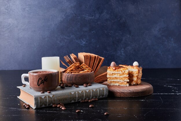 Cup of coffee with cake slices.