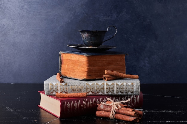 Cup of coffee with cinnamon sticks.