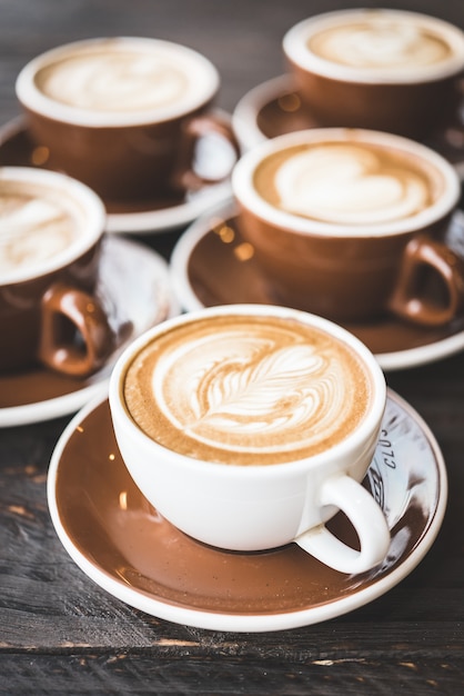 Cup of coffee with floral decoration