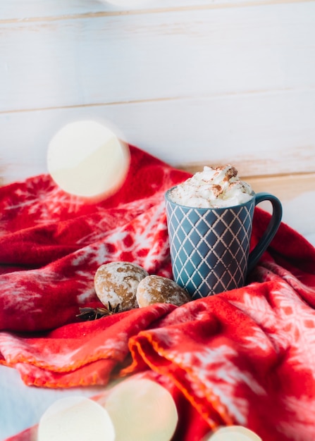 Free photo cup of coffee with whipped cream on table