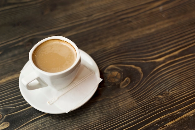 Cup of coffee on wooden tabletop