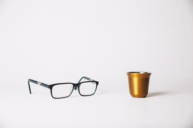 Cup and eyeglasses