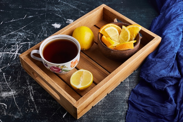 A cup of herbal tea with lemon. 