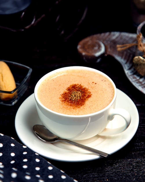 Free photo cup of hot cappuccino with cinnamon