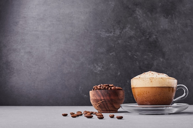 A cup of latte isolated on grey background.