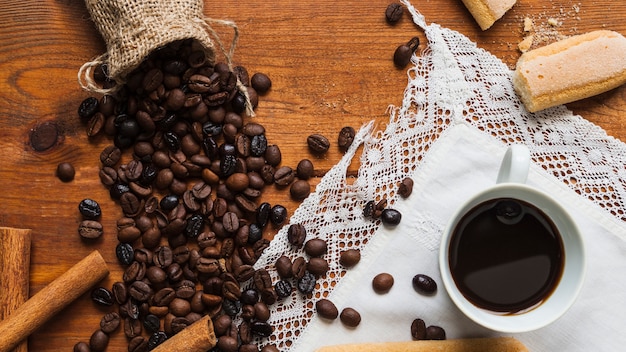 Cup near coffee beans