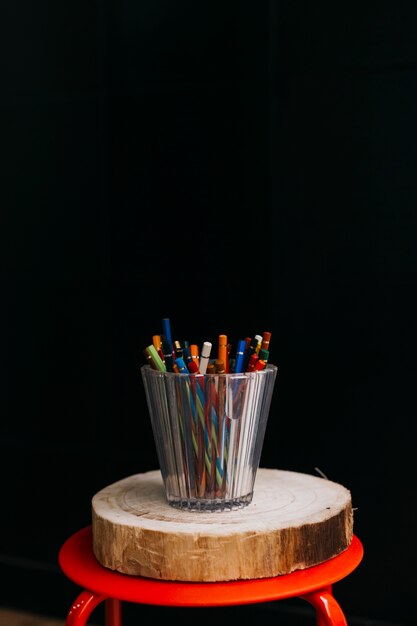 Cup of pencils on stool