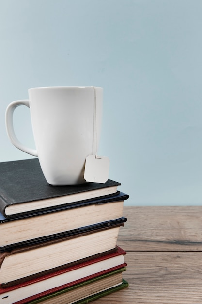 Cup of tea on books with copy space