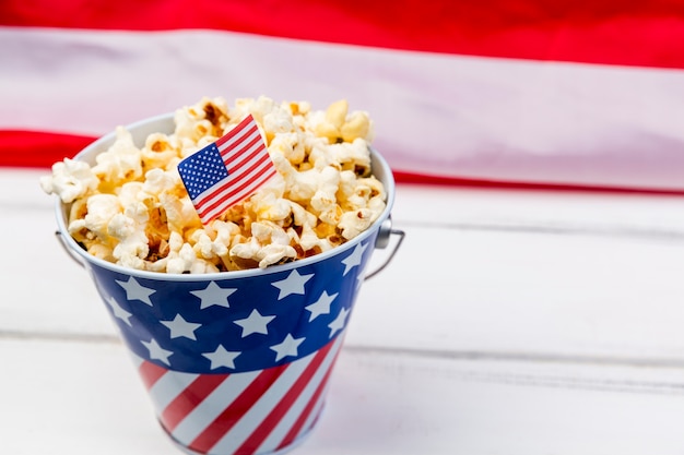 Cup with emblem of American flag and crunchy popcorn 