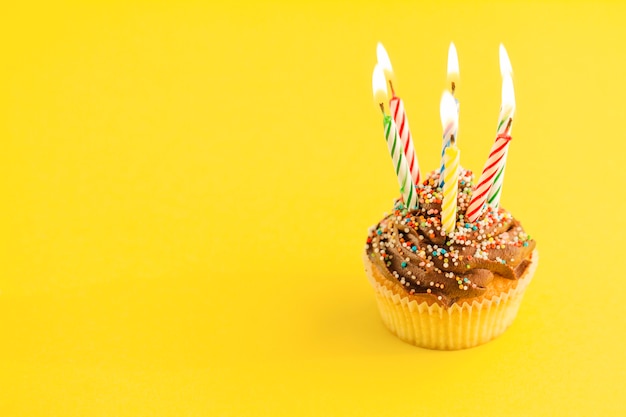 Cupcake with lighting candles