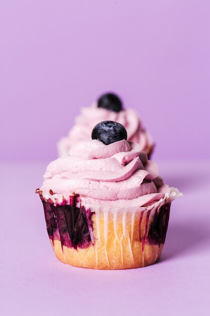 Cupcakes with blueberry and purple cream