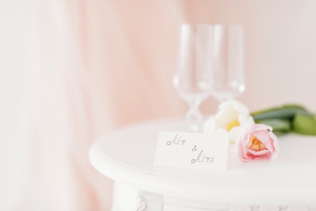 Cups and flowers on table