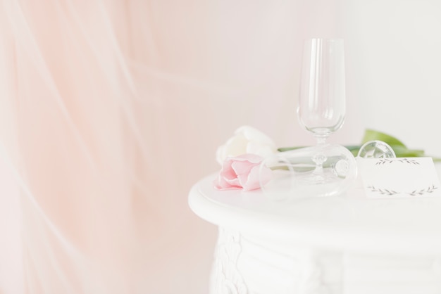 Cups and flowers on table