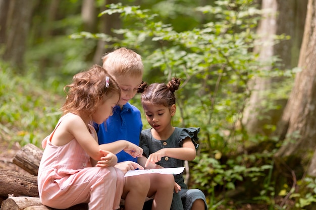 Free photo curious kids participating in a treasure hunt