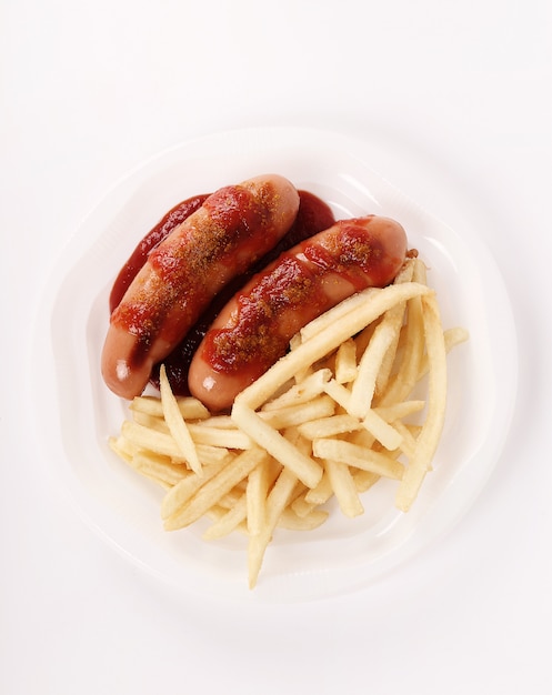 Curry wurst with sauce and french fries