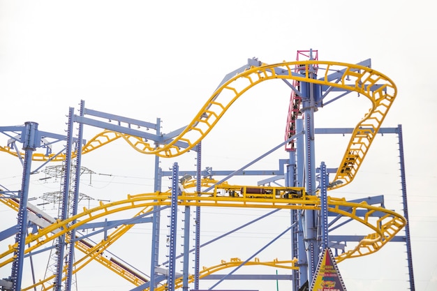 Free Photo curved rollercoaster tracks at the clear sky