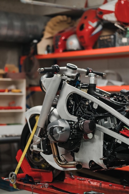 Custom motorcycle standing in repair shop